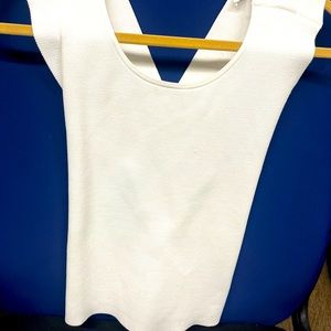 A.L.C. size med. thick white top, w/criss cross backing & high neck in front.